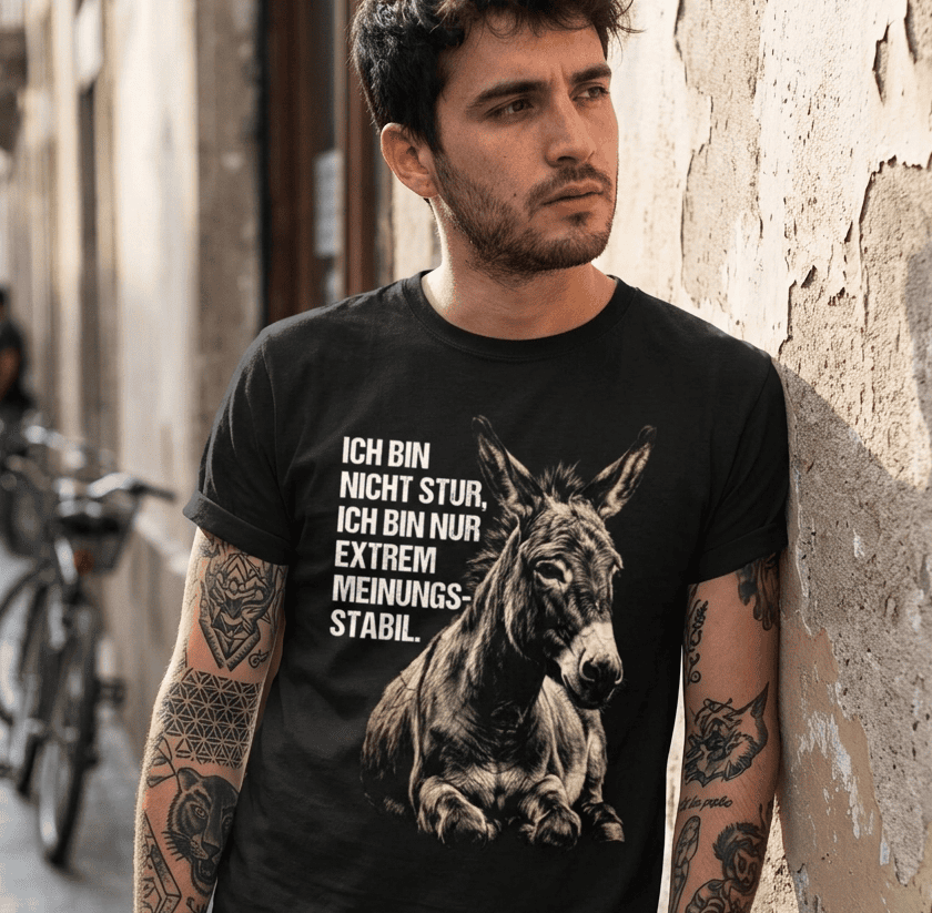 Mann trägt schwarzes T-Shirt mit Spruch Ich bin nicht stur, ich bin nur extrem meinungs-stabil.